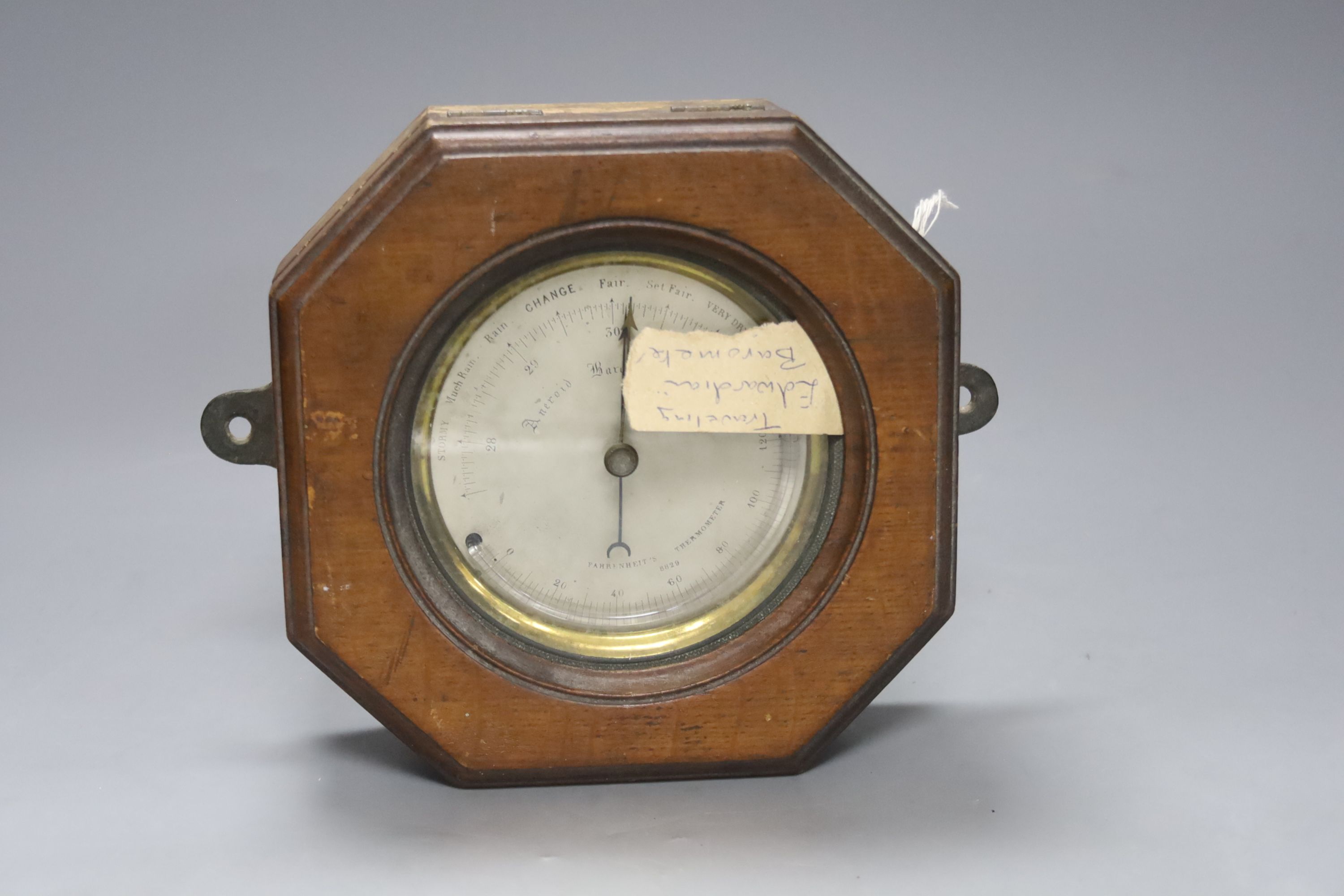 An Edwardian oak cased travelling aneroid barometer, height 19cm